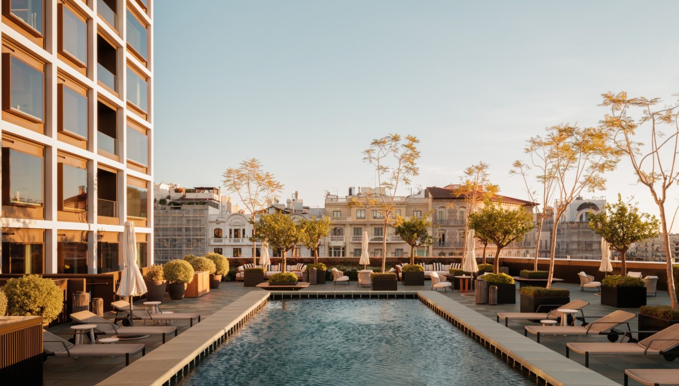 A scenic pool in a courtyard at sunset